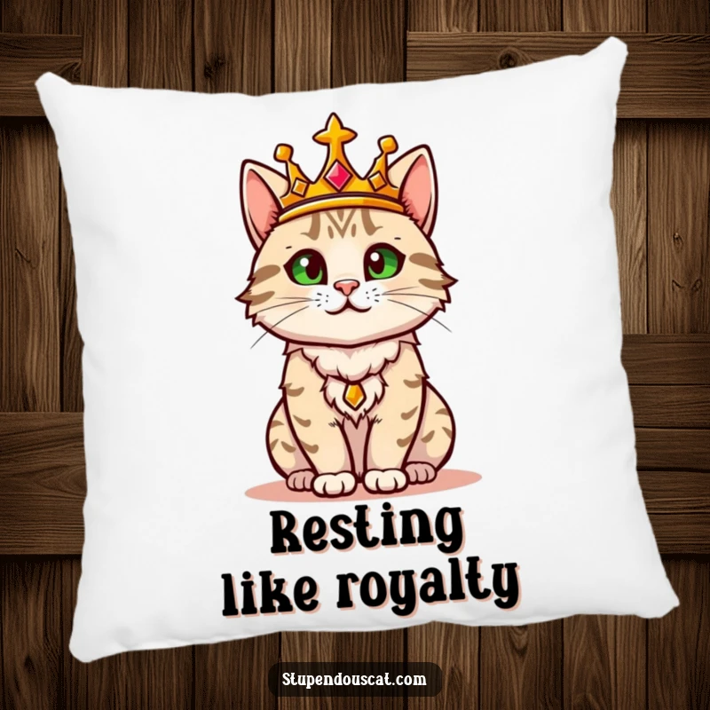 Funny pillow featuring a regal cat wearing a golden crown, confidently surveying its surroundings like a majestic ruler.
