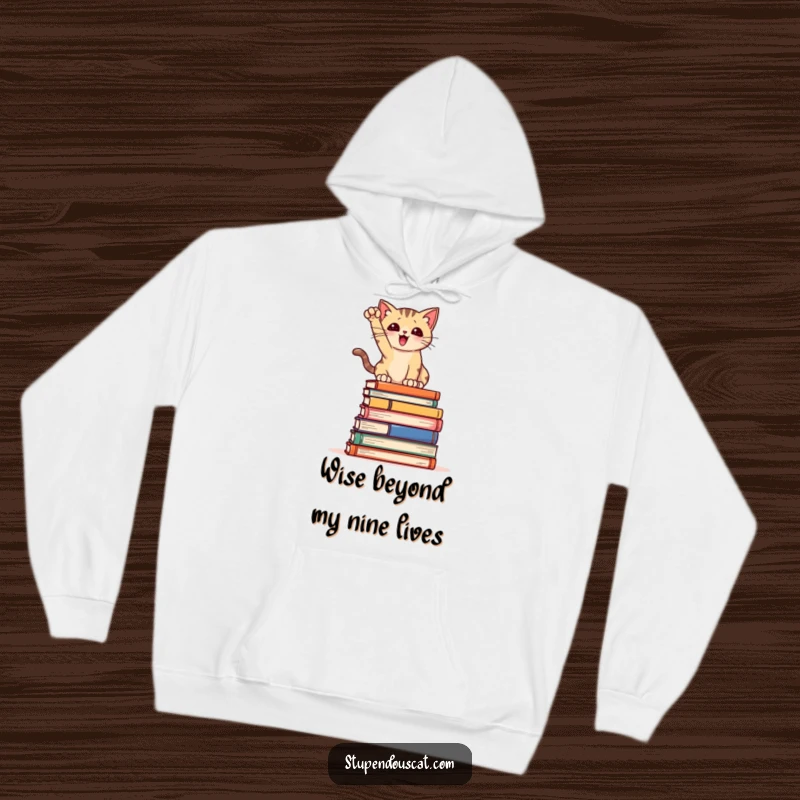 Funny Hoodie: A stylishly posed cat atop a tower of books, radiating intelligence and comedic charm, perfect for cozy reading.