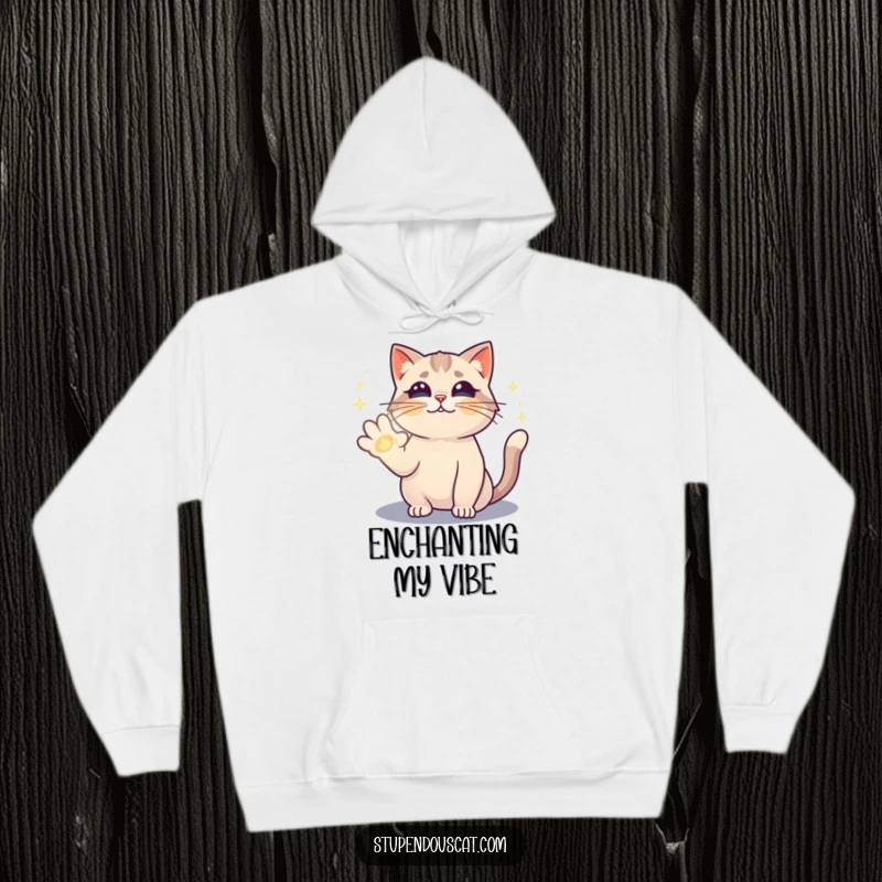 Funny hoodie showing a magical cat casting a shimmering spell with its paw, perfect for cozy, enchanted wear.