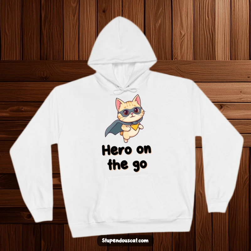 Funny hoodie with a cat wearing a superhero cape and flying with determination, offering warm comfort and heroic flair, a perfect gift.