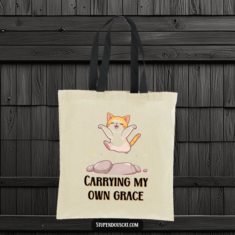 Funny cat tote bag illustrating a cat in mid-landing, showcasing its agility and a funny, determined expression.