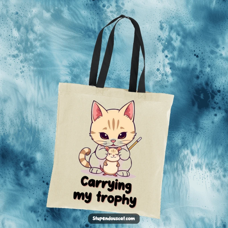 Funny tote bag depicting a valiant cat protectively guarding a small toy mouse, carrying your items safely with feline charm, a great gift.